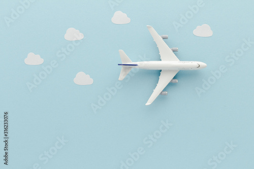 White top view Airplane . Airplane clouds blue cloud sky background with copy space for your text. Flat lay.