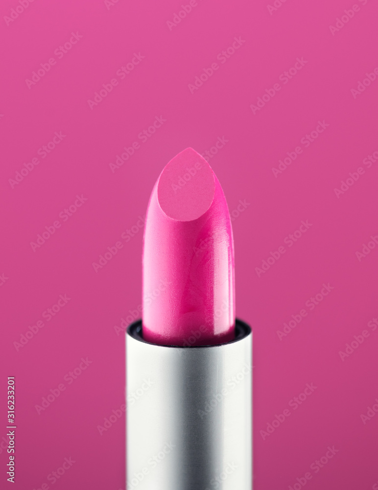 Pink Lipstick close-up, over pink background. Purple color lip stick, closeup. Lip gloss, make-up concept. Makeup concept Pink Lipstick close-up, over pink background. Purple color lip stick, closeup. Lip gloss, make-up concept. Makeup concept