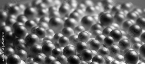 Abstract black and white background. Black foam balls. Mysterious objects, macro.