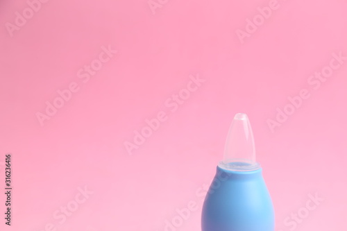 nasal aspirator for babies in colored background