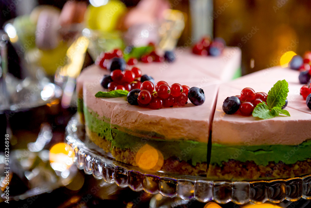 Cheesecake with blueberries on plate.