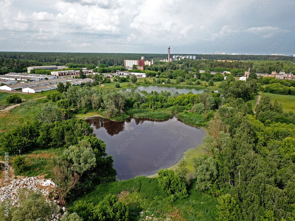 Aerial drone view. Forest lake in the country.