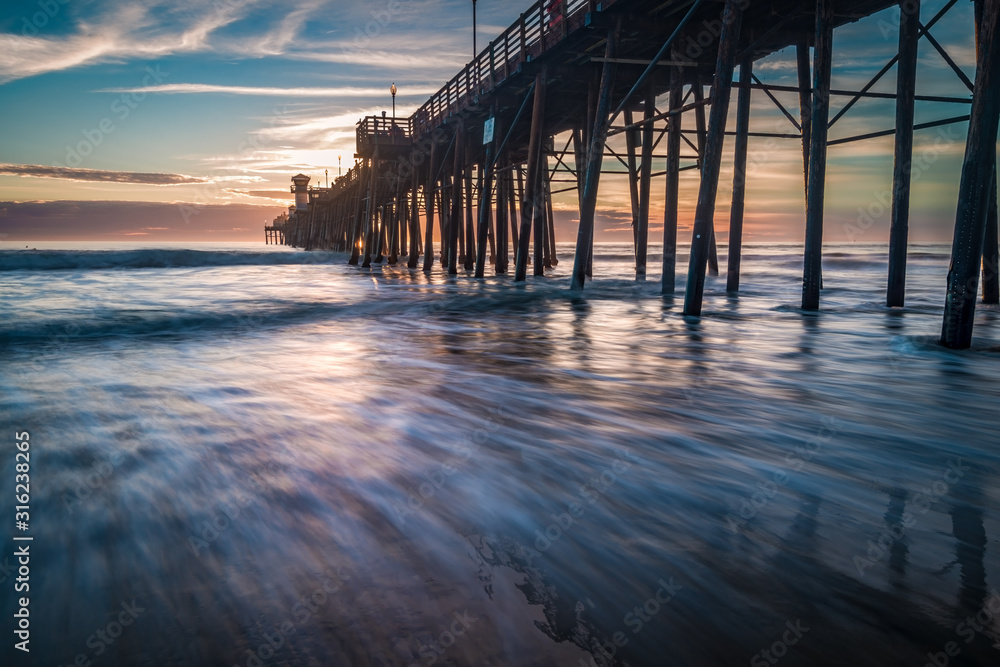 Long exposure sunset and surf at the pier