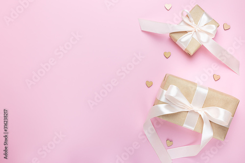 Two gift boxes on a pink background. Valentine s day. Holiday of lovers.