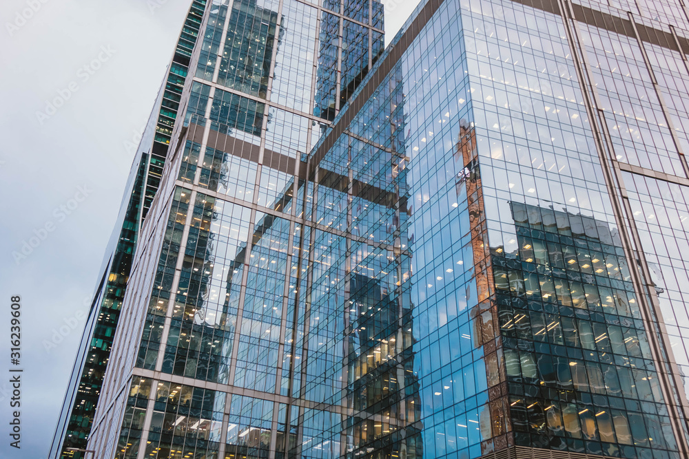 Modern skyscrapers close-up toned in blue color. Modern skyscrapers close-up toned in blue color.