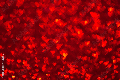 Abstract light, red bokeh pattern in heart shape. St Valentines Day or Holiday concept, background image.