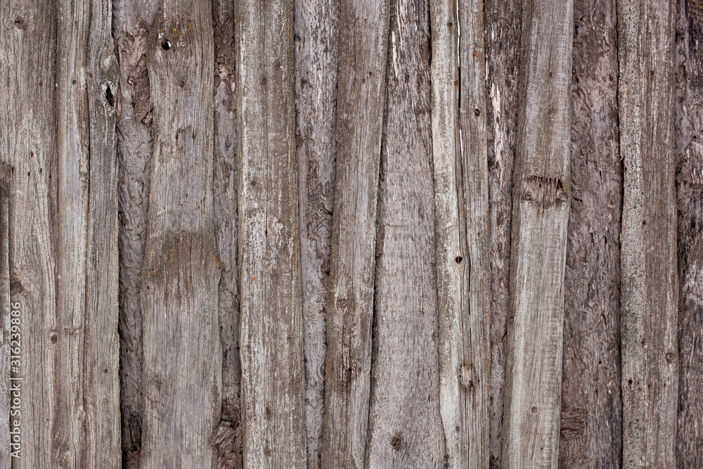 texture of an old wooden wall made of aged boards, wood structure, natural background