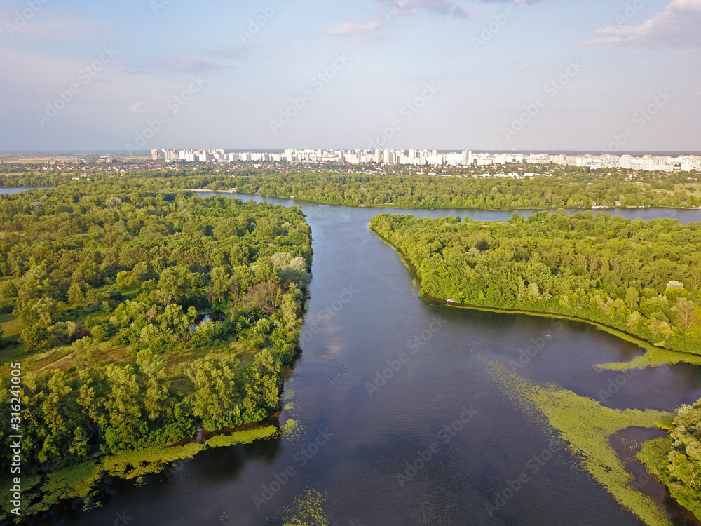 Aerial view. Dnieper tributaries among the green shores on the outskirts of the city