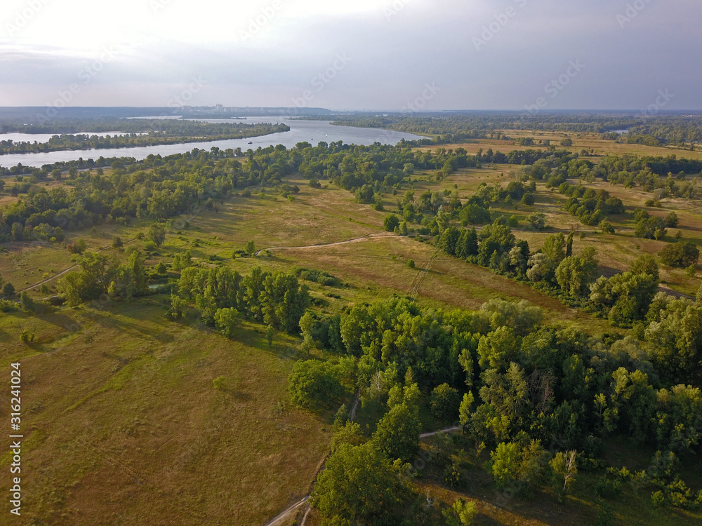 Aerial view. Dnieper tributaries among the green shores on the outskirts of the city