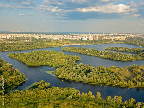 Aerial view. Dnieper tributaries among the green shores on the outskirts of the city © Sergey