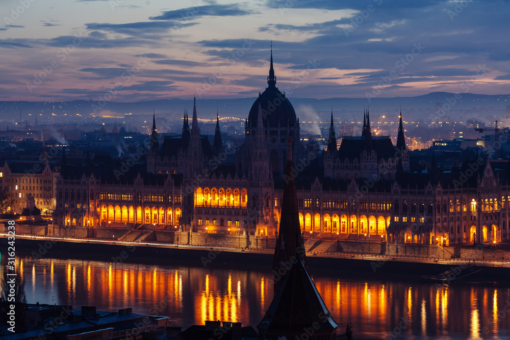 Morning view of illuminated Parliament building in Budapest,
