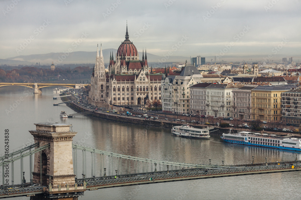 Morning in Budapest. Panoramic view of the city, Szechenyi Bridge and the building of the Budapest Parliament.