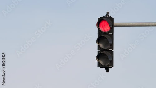 Traffic light semaphore changing colors from green to red