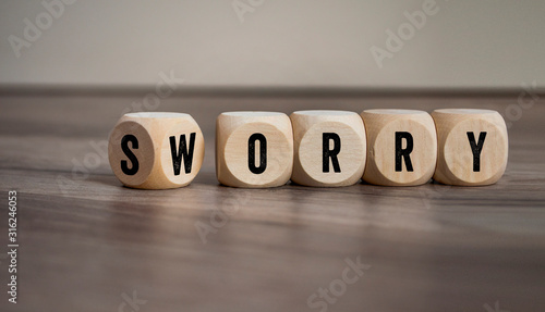 Cubes and dice with words sorry and worry
