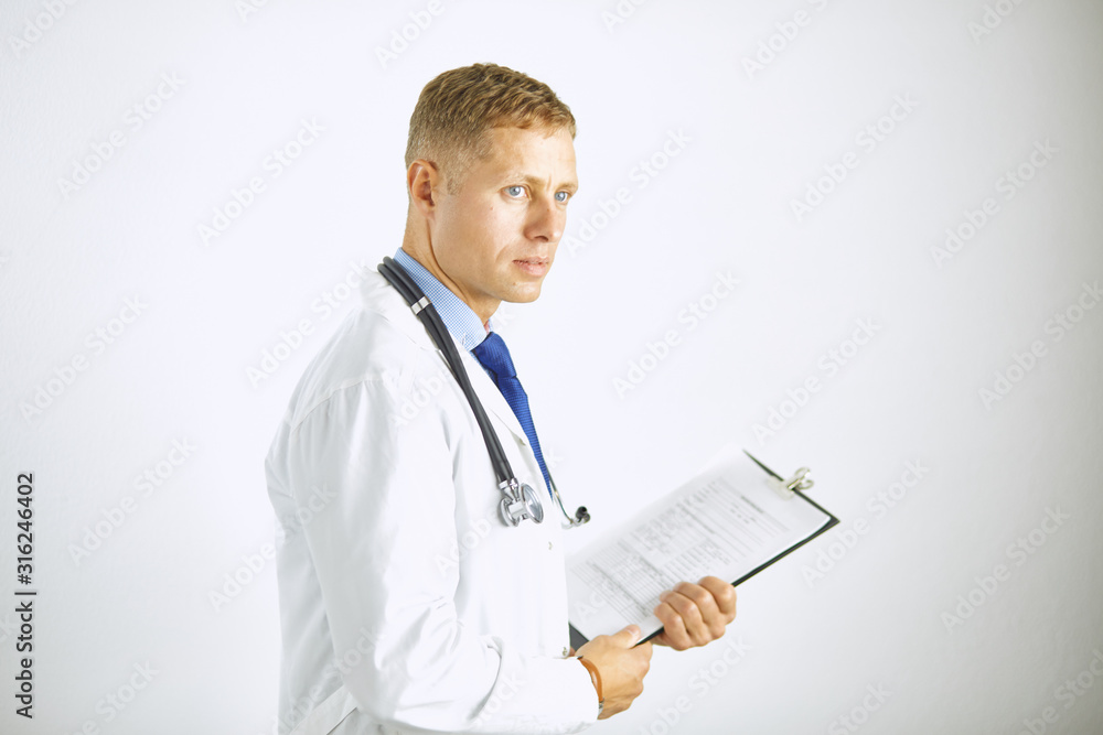 Young confident doctor in a white coat with a stethoscope Young confident doctor in a white coat with a stethoscope