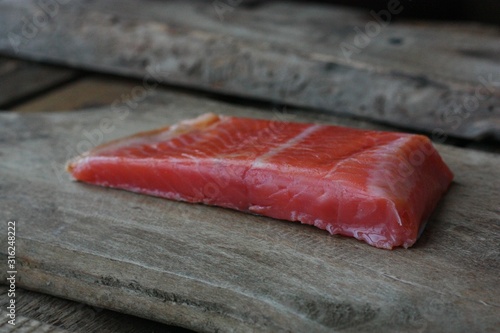 Fresh fish fillet on a wooden table