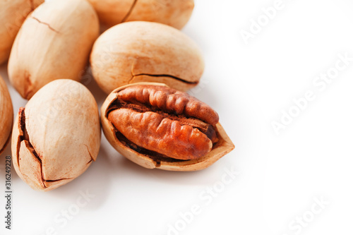 Pecan isolated on white background. Close-up, macro. A nut in a shell.