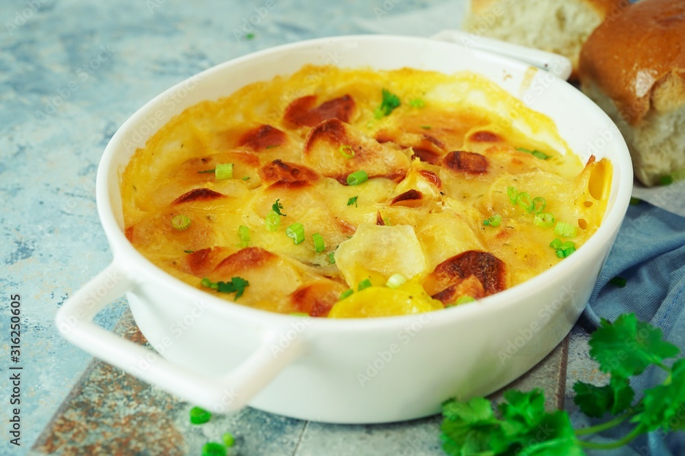 Homemade scalloped potatoes/ Potato gratin close up, selective focus