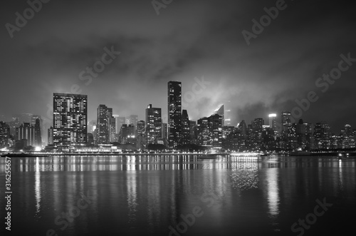 Manhattan in smoke cloud after 4th of July fireworks, New York City, USA. © MaciejBledowski
