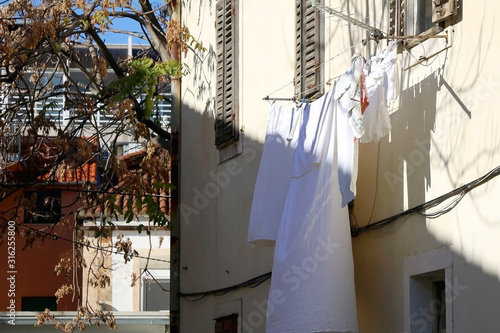 Mediterranean style rustic window and clothes drying outdoor in Split, Croatia. © jelena990