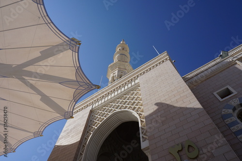 The Umbrella & Minaret of Prophet Mosque (Masjid An Nabawi), Medinah City, Saudi Arabia. photo