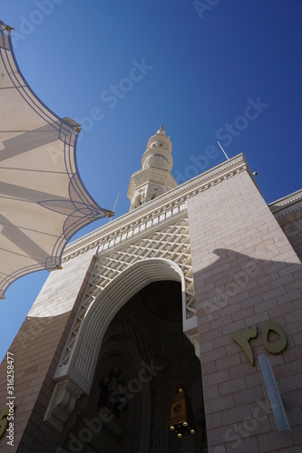 The Umbrella & Minaret of Prophet Mosque (Masjid An Nabawi), Medinah City, Saudi Arabia. photo