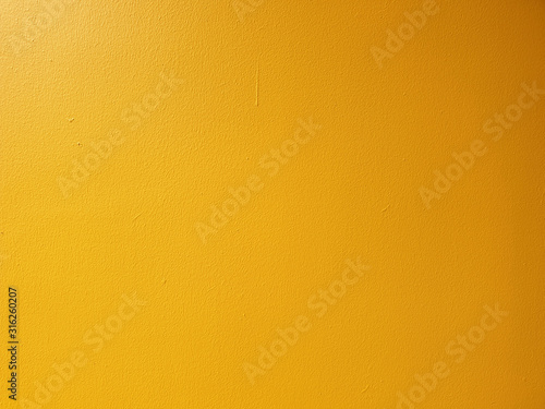 Textured Vintage yellow wall background. concrete tones in grunge style