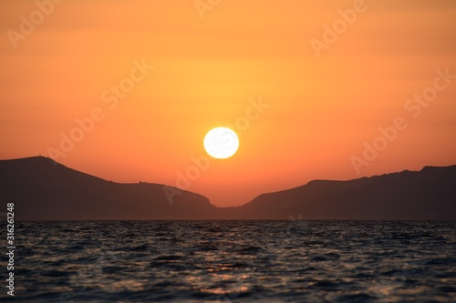 Sunset close-up on the background of mountains and sea