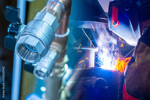 Welder at work. Welding of ...