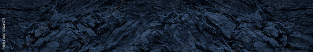 Blue toned mountain texture background. Abstract dark blue stone background.Grunge banner. Blue stone background. Rock backdrop.