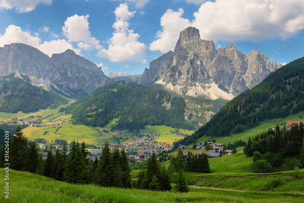 Obraz premium Sassongher peak and Corvara in Badia village in Dolomites Alps, Italy, Europe