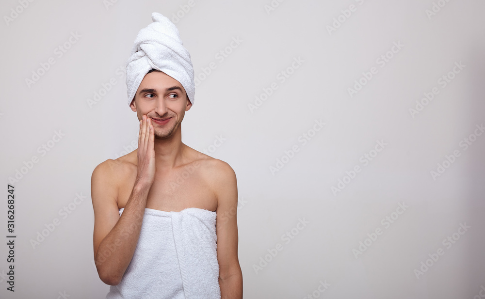 The cute guy after showering in a towel on his head. The cute guy after showering in a towel on his head.