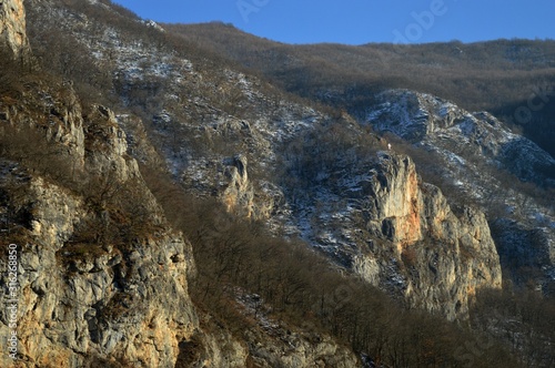 large rocks and hills in winter © oljasimovic