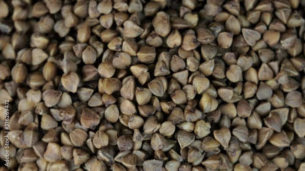 Buckwheat groats on a rotating background Buckwheat groats on a rotating background
