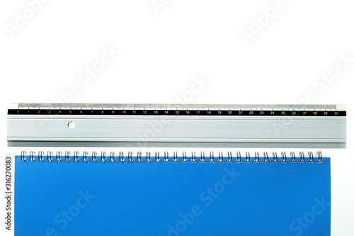 ruler laying straight at bottom of a white and blue page
