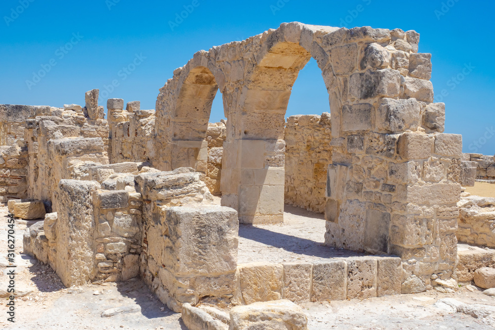 Cyprus. Limassol. Curion. The vaults of the early Christian Basilica have been preserved. The ruins of Kourion on the background of blue sky. Archaeological Park of Cyprus.