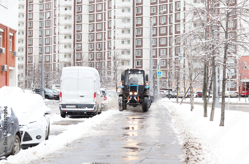 Snow removal on the streets of a big city. Great equipment, special snowplow.