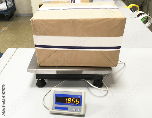 weighing and packing parcels in the post office