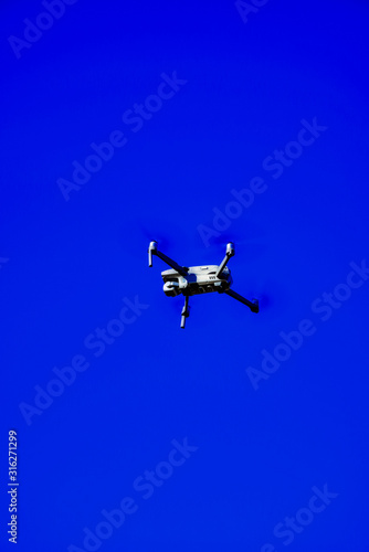 Fototapeta Naklejka Na Ścianę i Meble -  Video Drone in a Blue Sky