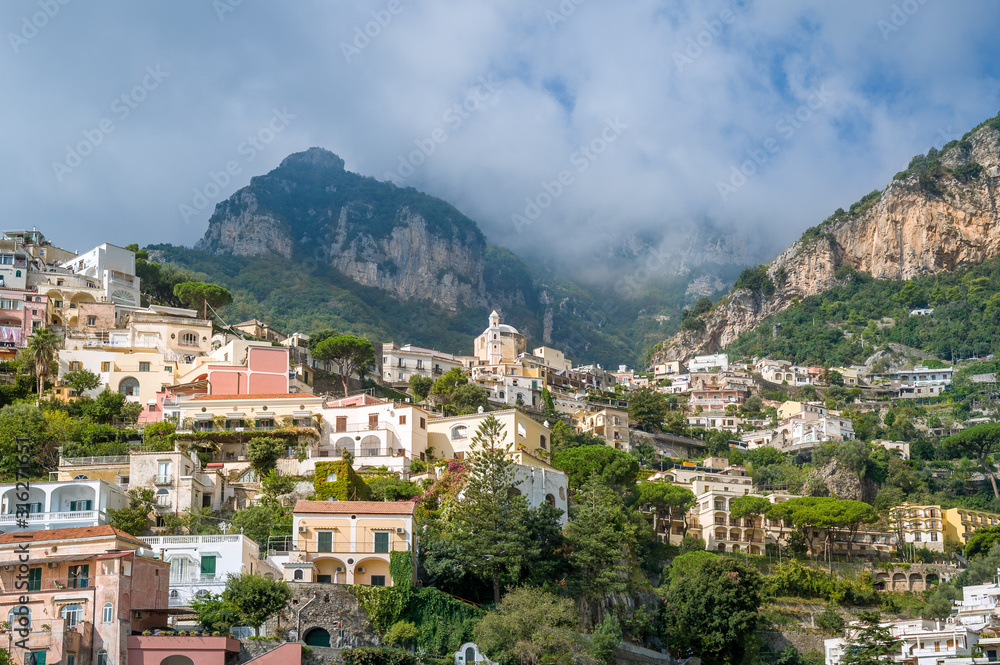 Amalfi coast landscapes - Positano village. Traditional colorful houses and mountain view. Italy.