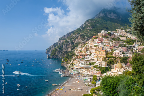 Postcard view of Positano village on the hills and mountain background. Amalfi coast, Italy.