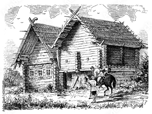 Two adjacent Russian isbas, small cottages built with wooden logs in rustic style