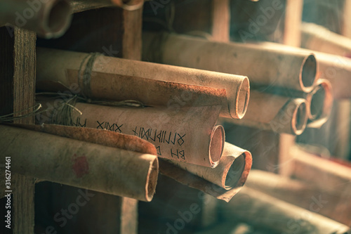 Vintage scribe library full of medieval and old scrolls