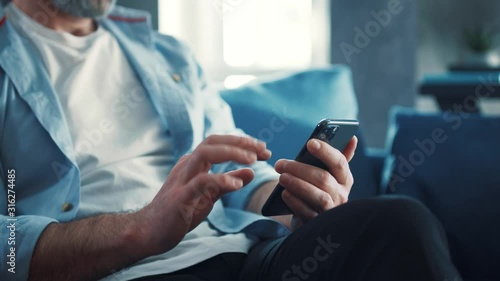 Close up view of male hands uses phone texting message, browsing surfinf internet tapping scrolling swip up social media browsing isolated technology application