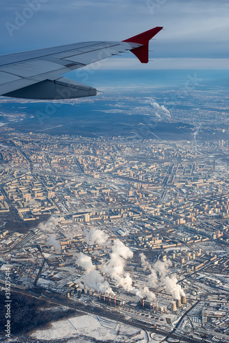 Winter view of Moscow from a plane with a CHP in the foreground