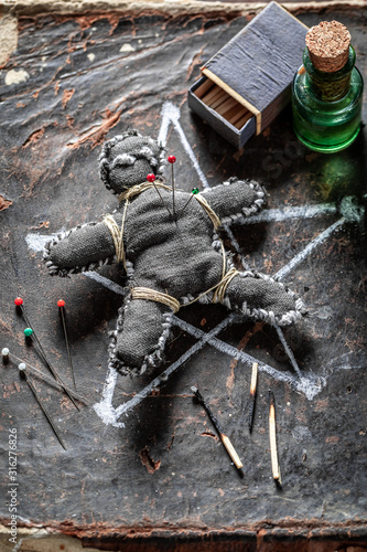 Extraordinary voodoo doll burned with fire as harming photo