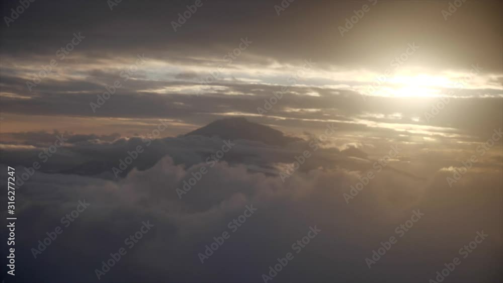 Medium shot, window view of a airplane moving in the sky, scenic view of mount Kilimanjaro sunset in the background. Medium shot, window view of a airplane moving in the sky, scenic view of mount Kilimanjaro sunset in the background.