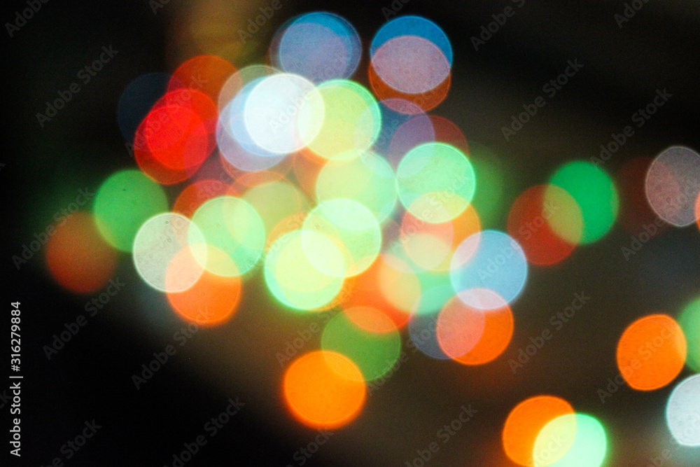Defocused abstract multicolored bokeh lights background. Red, yellow,  orange colors.