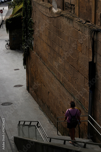 Person walking in a pedestrian street © Laiotz