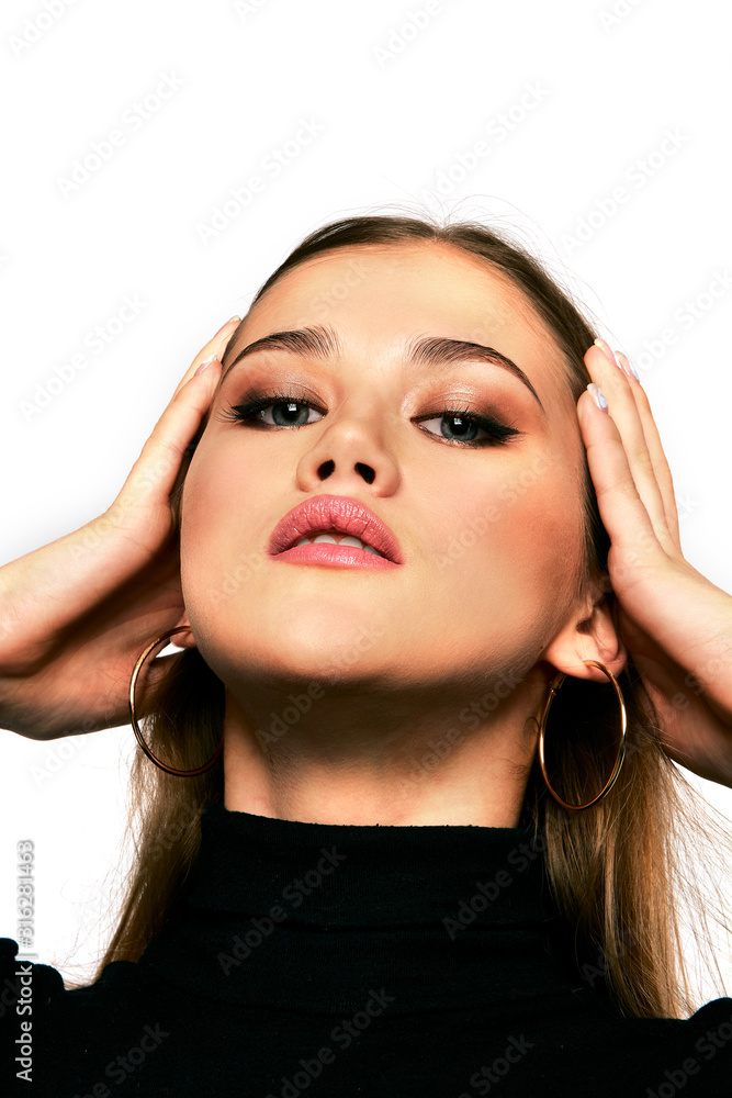 Fototapeta premium Close up portrait of beautiful young woman in black pullover. Blonde model girl with fashion perfect make up.